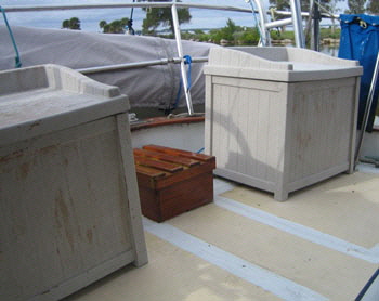 PVC patio boxes were fastened on the aft deck and store the gas bottle in the upright position.