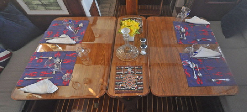 The new saloon table seats six yet when the leaves are down there is more room than the original table.