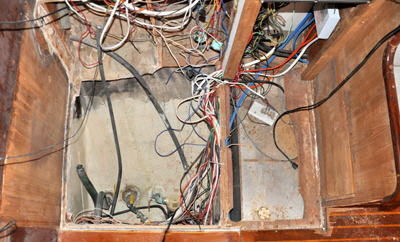 This shows the old chart table floor and wiring beneath.