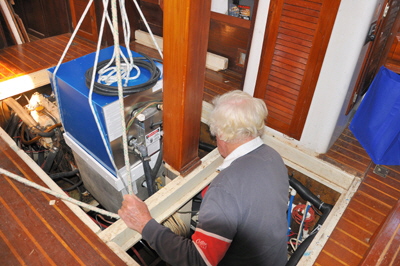 Lowering the heaters into the bilge.