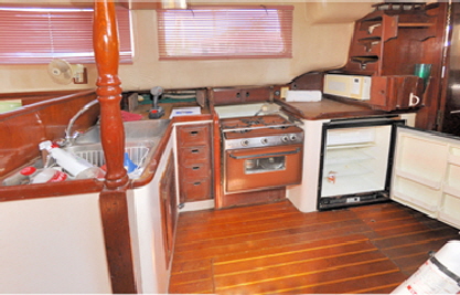 This shows the original galley with an old stove and refigerator that did not work properly.