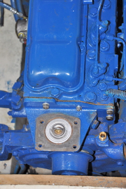 The thermostat was housed under the engine header tank.
