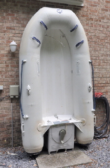 New dinghy proped upright.